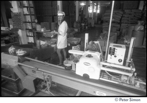 Worker in the packaging area, Erewhon Food Coop Farnsworth Street warehouse
