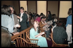 Scene inside the courtroom following acquittal in the CIA protest trial: Amy Carter seated in a chair