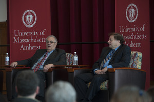 Congressman Barney Frank and author Stuart Weisberg seated on the Student Union Ballroom stage, UMass Amherst, during their book event