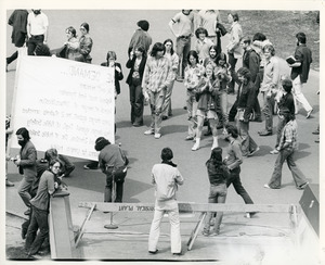 Board of Trustees fee increase demonstration: protestors applauding a speaker in front of the Whitmore Administration Building