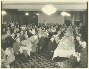 Faculty and staff members seated at a banquet
