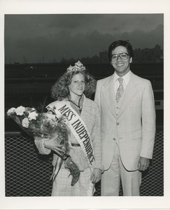 Miss independence poses with man