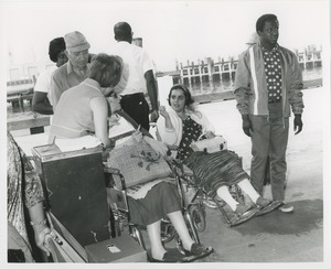 Women in wheelchairs at pier