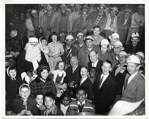 Mayor John F. Collins at Christmas party with children and shipfitters