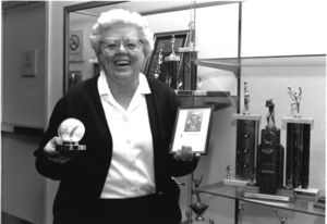 Suffolk University Law School Librarian and alumnus Patricia I. Brown donating items related to her career in the All-American Girl's Professional Baseball League to the university