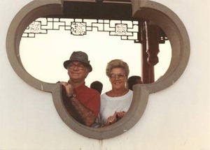 Congressman John Joseph Moakley and Evelyn Moakley looking out of a Chinese style building on a congressional trip to China