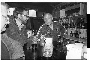 Gusty Spence drinking inside Malvern Bar, Belfast with other customers shortly after his release from prison