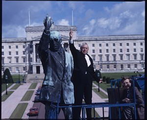 Rev. Ian Paisley leader of the DUP, MLA and MEP, posing beside the statue of Sir Edward Carson in front of the Stormont building, standing on a 40-foot high hydraulic lift