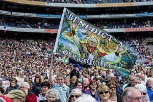 Crowd scene, with young boy waving a large flag with a picture of Pope Benedict XV on it, at the 2012 50th Eucharistic Congress, Final Day Ceremony, 17th June, at Croke Park GAA Stadium, Dublin