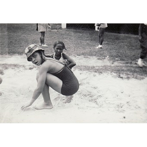 Two girls play in the sand at Breezy Meadows Camp