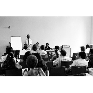 Jorge Hernandez addressing a room full of people.