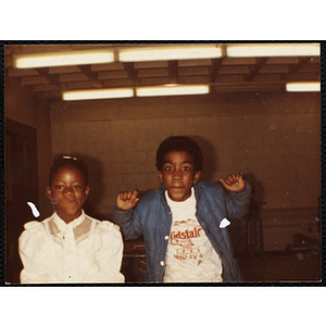 African American boy and girl posing together during a class at the Boys and Girls Club