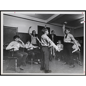 The Bunker Hillbillies receive dance instruction from an unidentified woman
