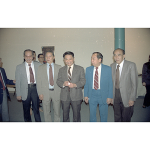You King Yee stands with four other men at a welcome party for the Consulate General of the People's Republic of China
