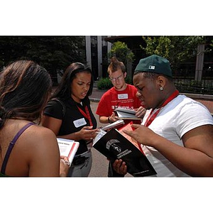 Four students work together during the Torch Scholars Scavenger Hunt