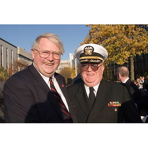 Neal Finnegan poses with a man in military uniform at the Veterans Memorial dedication ceremony