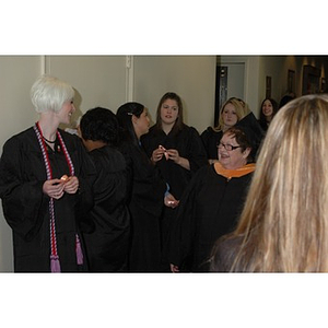 Students and professor waiting for School of Nursing convocation to begin