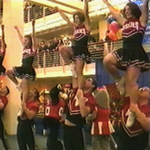 Cheerleaders performing at the dedication of the Curry Student Center