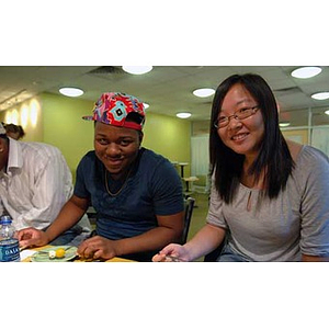 Ulysses Ifill and Qinrui Pang smile when the Torch Scholars visit the Exhibition Kitchen