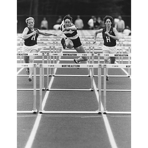 Kelly Toole leads in the 100-meter hurdle race