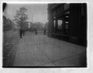 View of street corner with four people