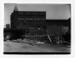 View of construction site in front of Steel Office Furniture building