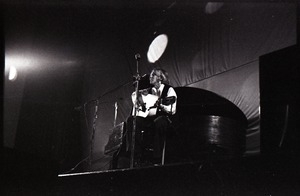 Unidentified female twelve-string guitar player in concert