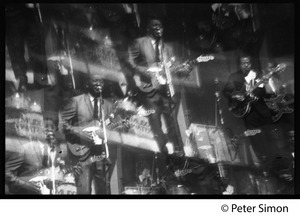 Kaleidoscopic image of Muddy Waters performing at the Newport Folk Festival