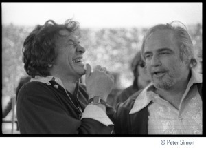 Bill Graham (left) talking to Marlon Brando