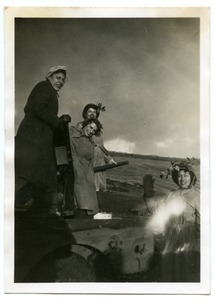 American Red Cross Clubmobilers on top of a tank