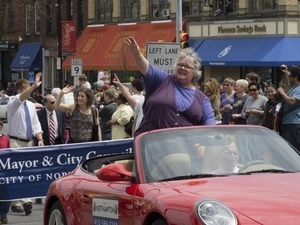 Mayor Clare Higgins waving to the crowd from an automobile during the Pride Parade; Main Street, Northampton, Mass.