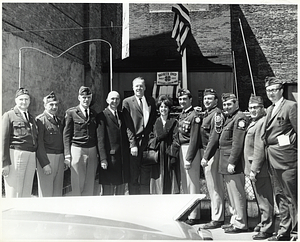 Massachusetts Representative John Sears (center) with an unidentified man, woman, and veterans at the Veterans of Foreign Wars Post 144 in the North End.