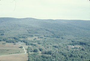 Aerial oblique view West over NW Hill Road with Shoen's house on left and Whitman's house on right 2 Sept 1971.