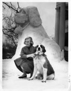 Winter Carnival Queen Sally Putnam with Kappa Alpha Fraternity mascot and snow sculpture, 1956