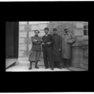 Four men in different uniforms