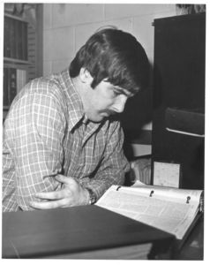Larry Boyle, executive editor of Suffolk Law Review pores over case in the Law Review offices, circa 1970s