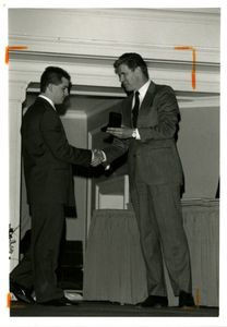 Suffolk University Athletics Director James E. Nelson presenting an award at the 1996 Recognition Day