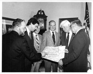 Speaker Tip O'Neill, John Joseph Moakley and others review at map in Washington D.C., 1980s-1990s