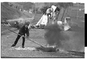Children burn tyre and block Flying Horse Road, Downpatrick, Co. Down, anniversary of internment year different to items 22-25