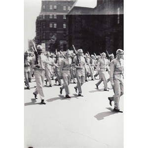 An unidentified group of students marches with rifles in the Boston School Boy Cadets parade