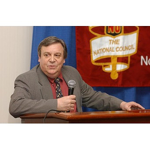 Unidentified speaker at a podium at The National Council Dinner