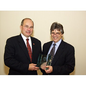 Dr. Ira R. Weiss, right, presents College of Business Administration's Distinguished Service Award to Robert DiCenso, CBA '62