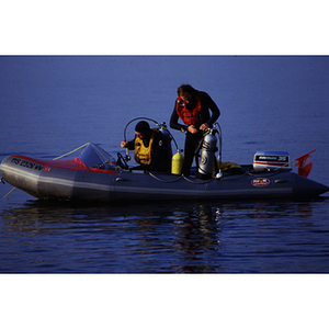 Two marine researchers preparing to scuba dive