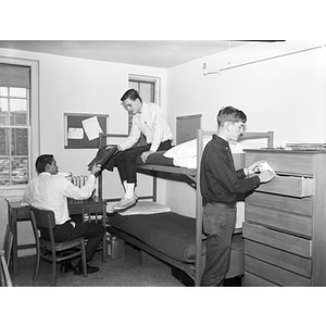 Three male students in a White Hall dormitory room