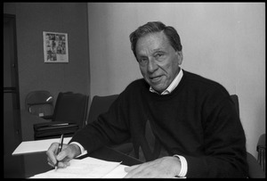 Eugene M. Isenberg: portrait, seated at a desk