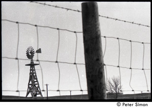 Wire fence and windmill