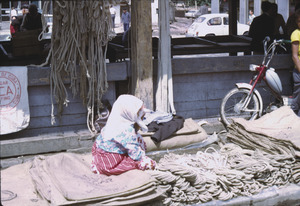 Muslim child at market stand