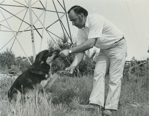 Joe Hart feeding a dog