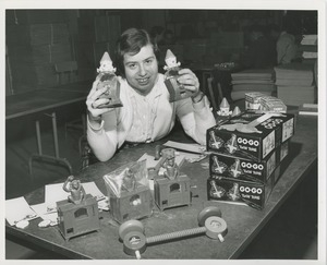 Woman displaying toys