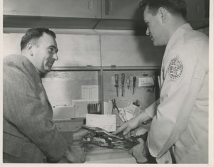 A technician collaborates with a doctor on the fabrication of a leg brace